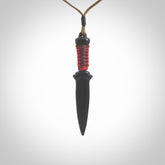 Hand carved dagger made from black jade. The cord is adjustable so that you can wear this where it suits you best. We ship this worldwide and the postage is included in the price.